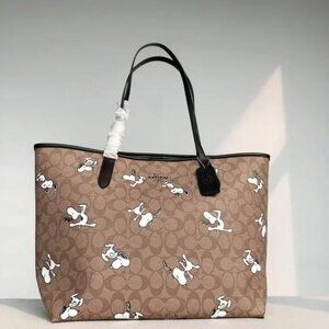 Coach X Peanuts City Tote In Signature Canvas With Snoopy Woodstock Print